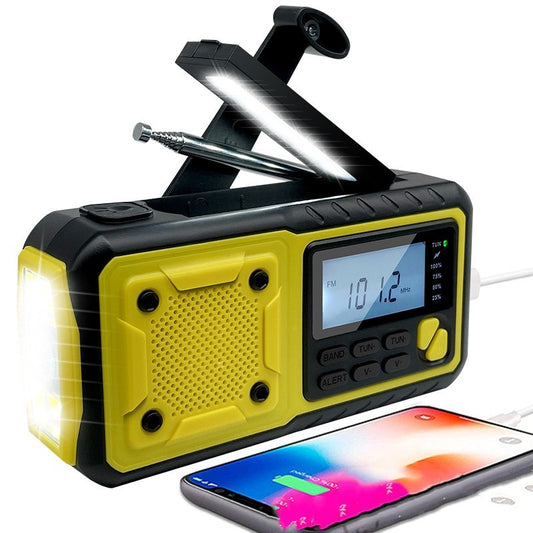 Portable emergency radio with solar panel